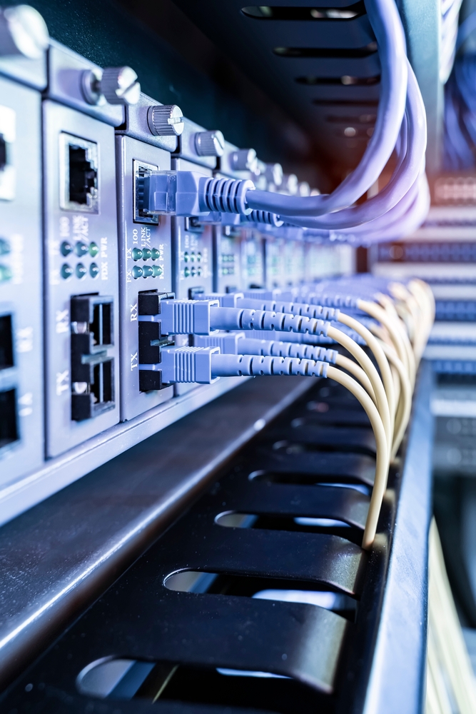 Fiber,Optical,Cables,Connected,To,An,Optic,Ports,And,Network